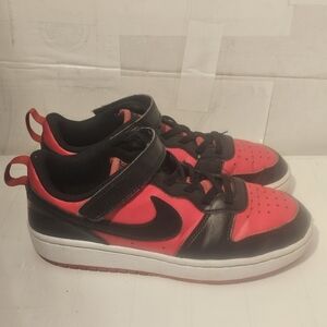 Nike Black and Red Low-Top Sneakers with Lace-Up Closure